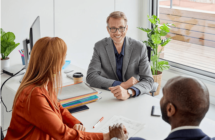 three_people_at_the_desk